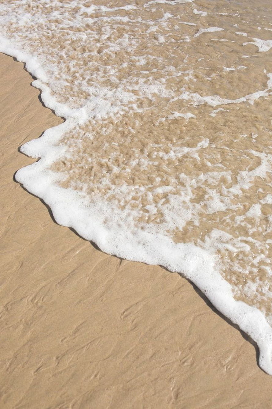 Beige Beach Shoreline With Gentle Seafoam Waves Rolling Onto Sand HD phone wallpaper