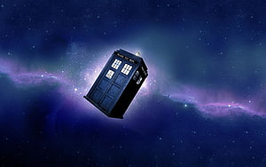 TARDIS Floating in a Vibrant Purple and Blue Nebula Space Scene HD wallpaper