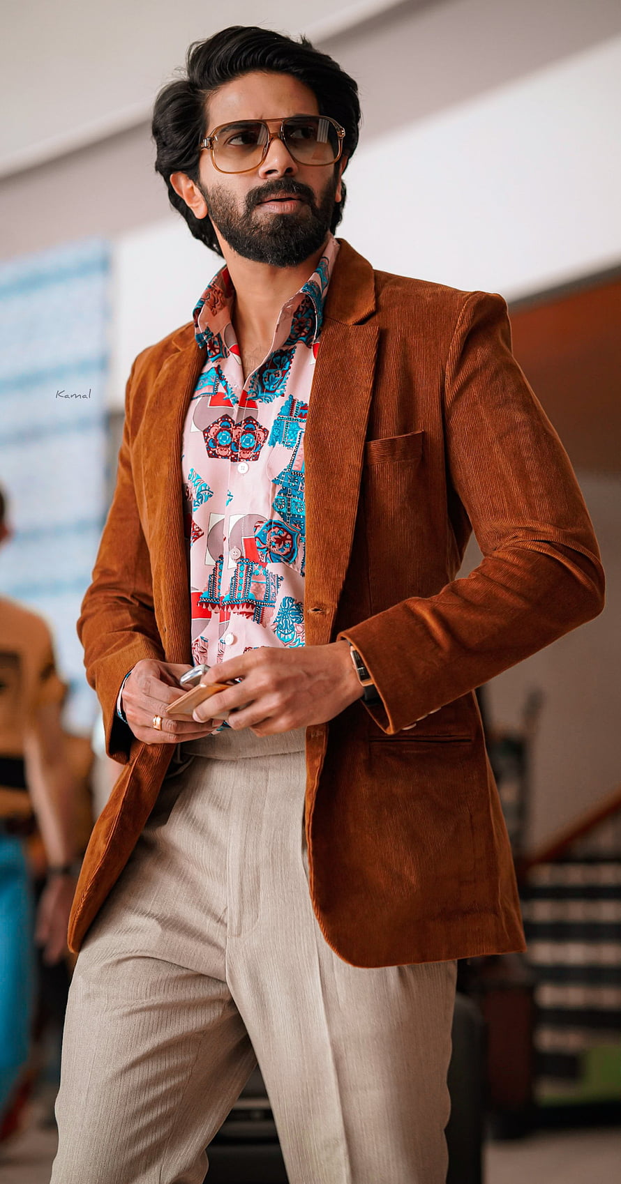 Dulquer Salmaan in a brown corduroy blazer and patterned shirt with aviator sunglasses HD phone wallpaper