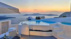 Santorini Cliffside Infinity Pool at Sunset with Aegean Sea View HD wallpaper