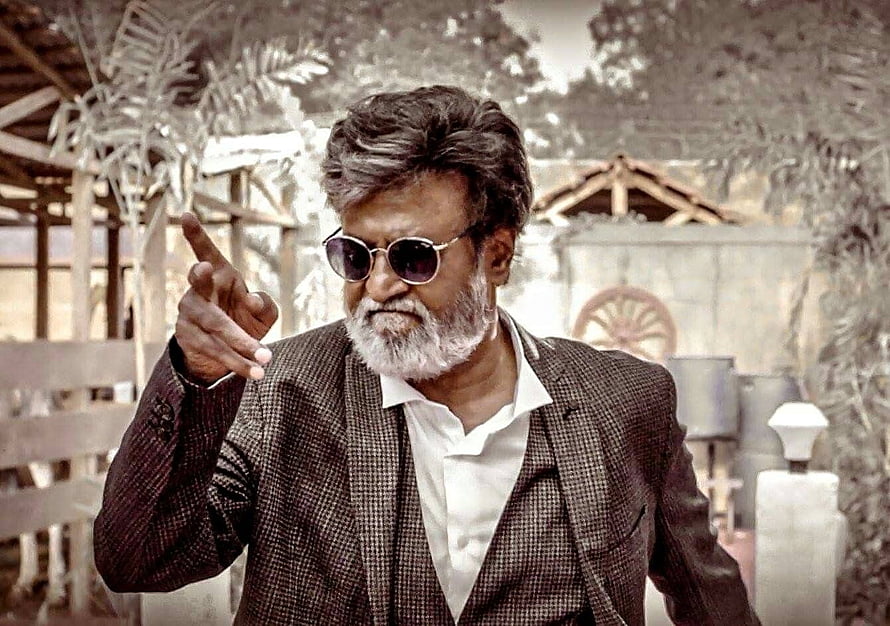 Rajinikanth in Kabali pointing forward in a checkered suit and sunglasses HD wallpaper