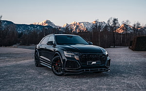 Black ABT Audi RS Q8 SUV Parked on Gravel with Snow-Capped Mountains in Background HD wallpaper