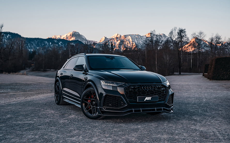 Black ABT Audi RS Q8 SUV Parked on Gravel with Snow-Capped Mountains in Background HD wallpaper