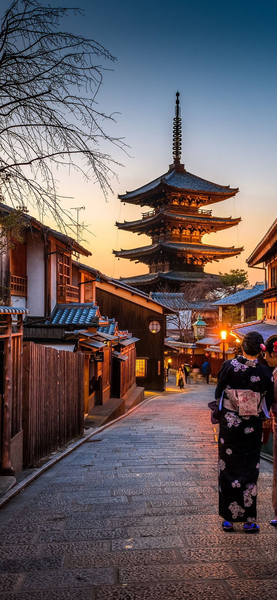 Woman in Kimono Walking Through Historic Kyoto Street at Sunset HD phone wallpaper