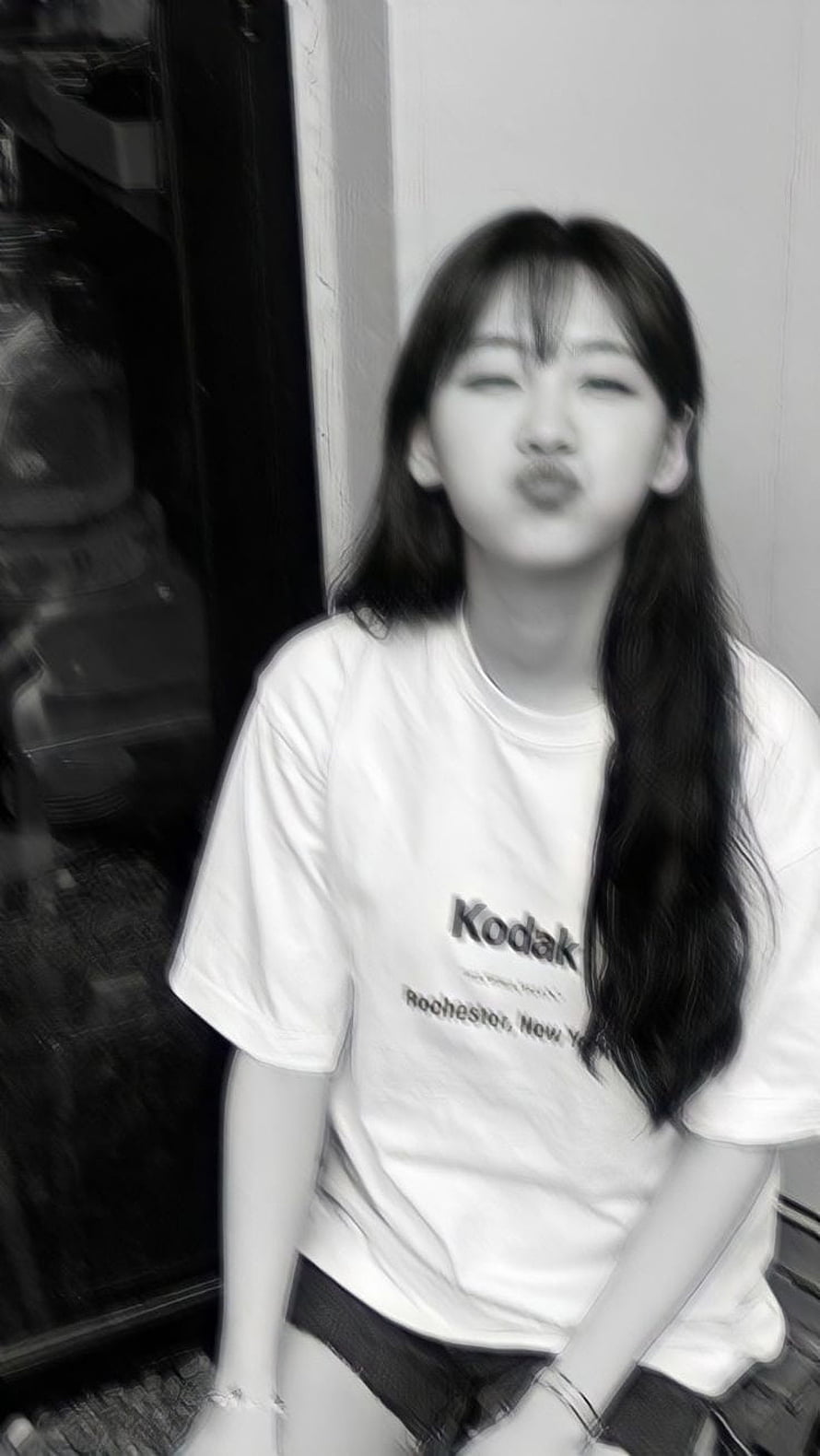 Cho Yi Hyun in a white Kodak t-shirt making a playful pouty face in a black and white portrait HD phone wallpaper