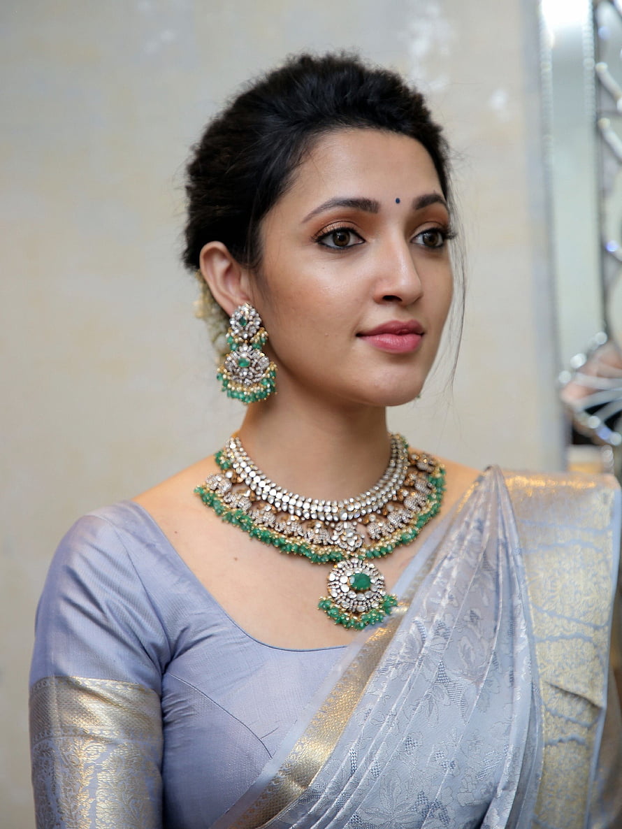 Neha Shetty in Silver Saree with Emerald and Diamond Jewelry HD phone wallpaper