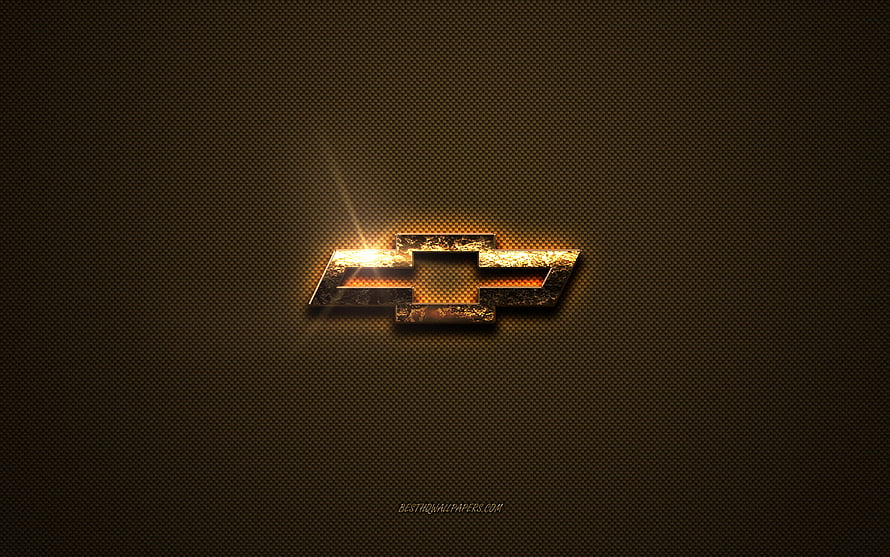 Chevrolet Golden Bowtie Emblem on Textured Brown Metal Surface HD wallpaper