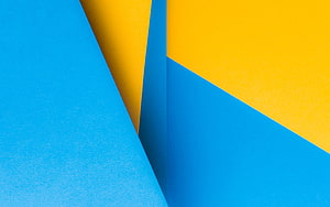 Vibrant Blue and Yellow Geometric Paper Composition with Sharp Angular Lines HD wallpaper