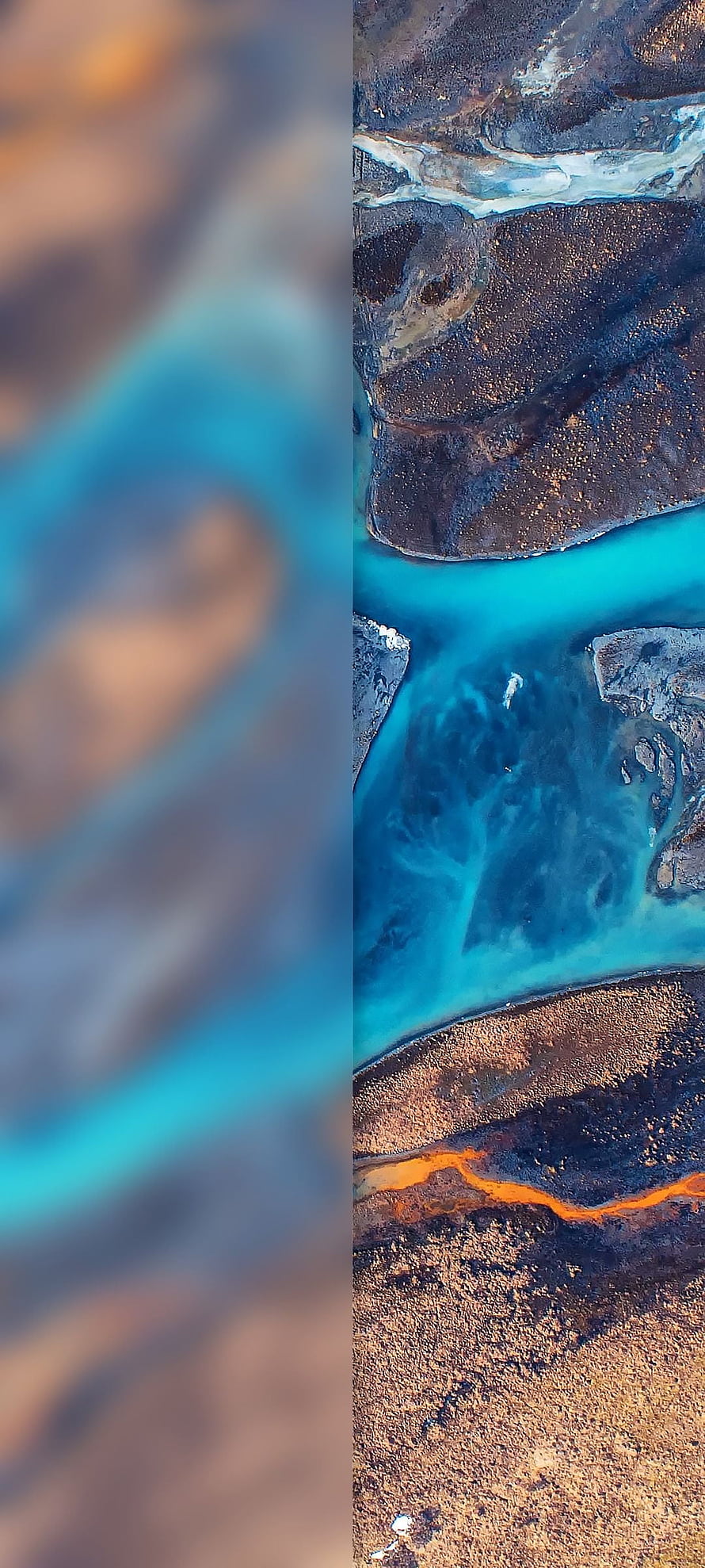 Aerial View of Turquoise River Carving Through Dark Volcanic Rock and Arid Terrain HD phone wallpaper