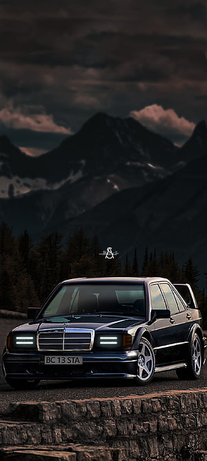 Black Mercedes-Benz W124 Pickup Truck with LED Headlights Parked Against Dramatic Mountain Landscape HD phone wallpaper