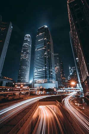 Hong Kong Night Skyline With Long Exposure Traffic Trails And Illuminated Skyscrapers HD phone wallpaper