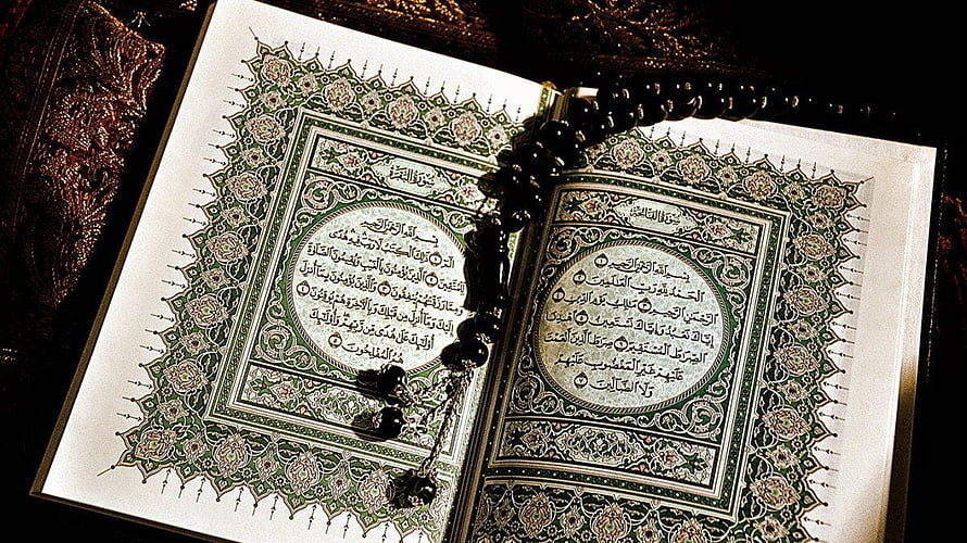 Ornate Open Holy Quran with Prayer Beads and Intricate Islamic Calligraphy HD wallpaper