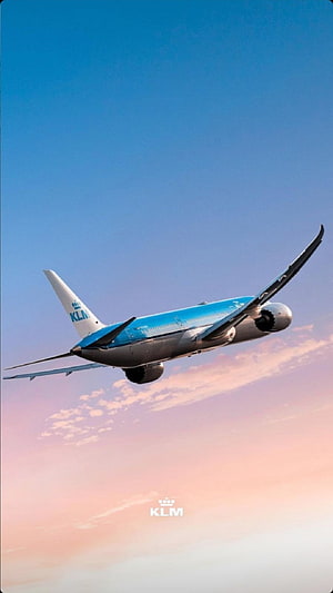 KLM Royal Dutch Airlines Passenger Jet Climbing Through a Pastel Sunset Sky HD phone wallpaper