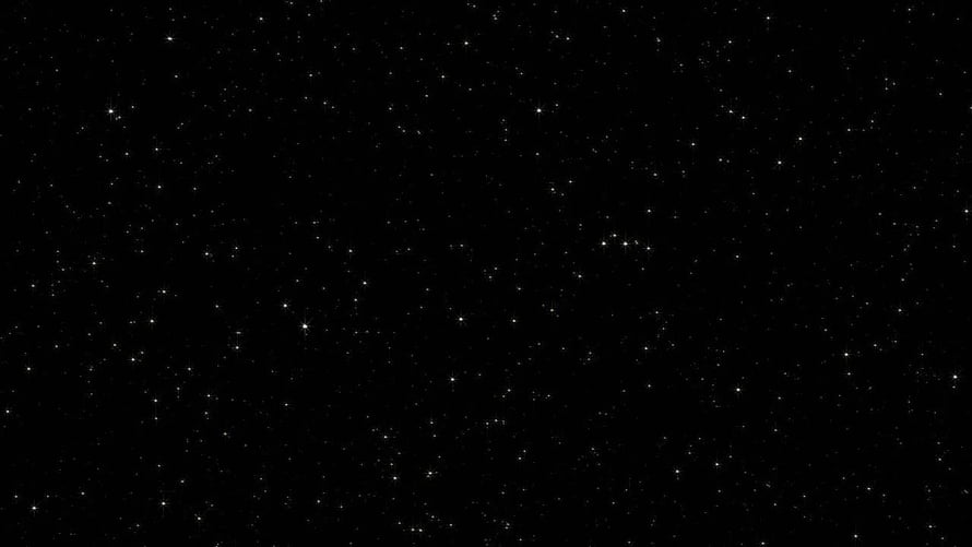 Minimalist Black and White Starfield with Scattered Twinkling Points of Light HD wallpaper