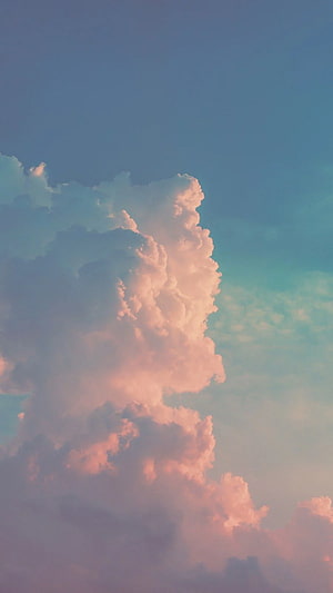 Soft Pink Cumulus Clouds Against a Gradient Blue Sky at Golden Hour HD phone wallpaper
