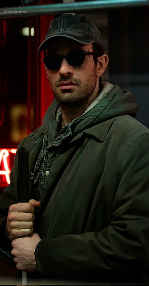 Charlie Cox as Matt Murdock in Daredevil wearing sunglasses and a green hooded jacket HD phone wallpaper
