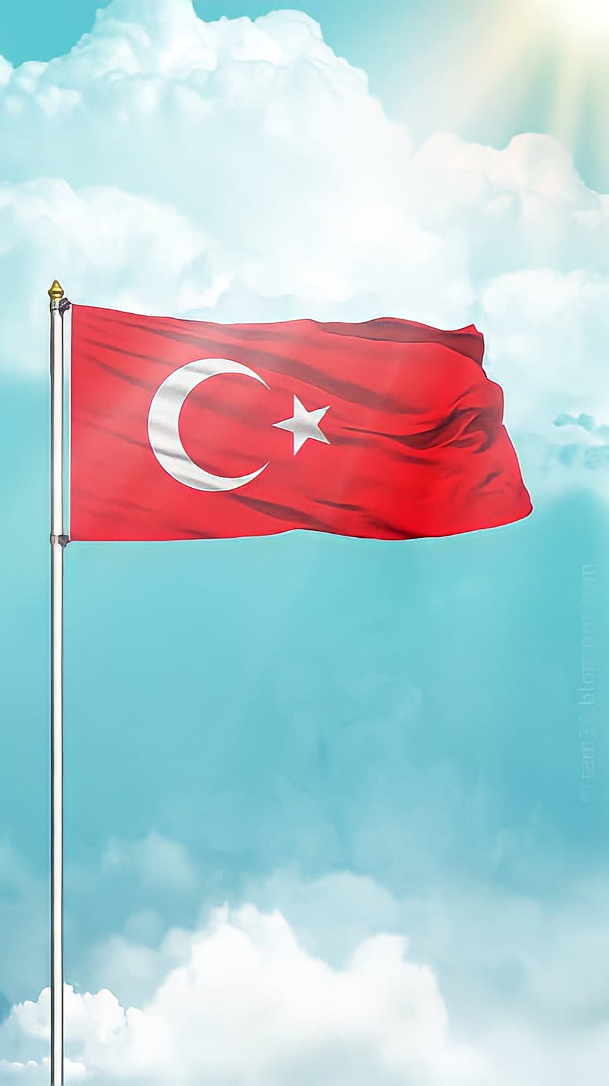 Turkish National Flag Waving Against a Bright Blue Sky with Fluffy White Clouds HD phone wallpaper