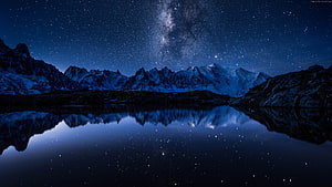 Milky Way Galaxy Over Snow-Capped Mountain Range Reflected in a Still Alpine Lake at Night HD wallpaper