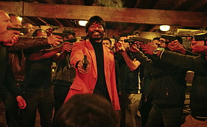Dhanush in a dramatic standoff scene from the Tamil film Jagame Thanthiram HD wallpaper