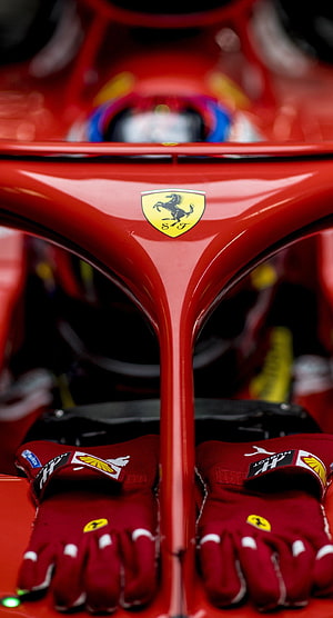 Ferrari Formula 1 Cockpit Detail with Racing Gloves and Prancing Horse Emblem HD phone wallpaper