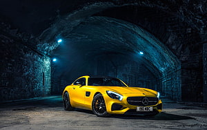 Vibrant Yellow Mercedes-AMG GT R Parked in a Dark Stone Tunnel HD wallpaper