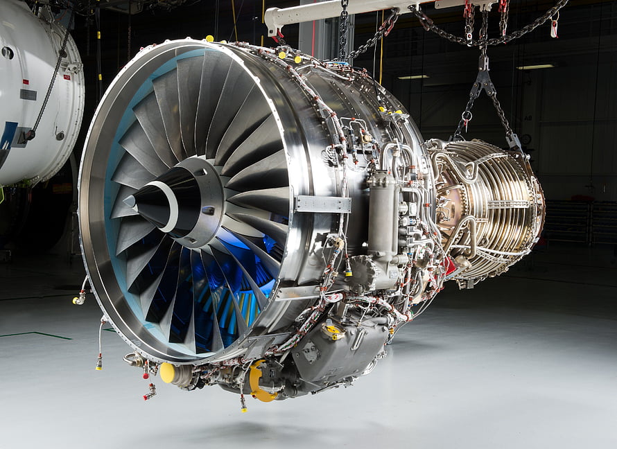 Large Turbofan Jet Engine Suspended in Industrial Hangar HD wallpaper