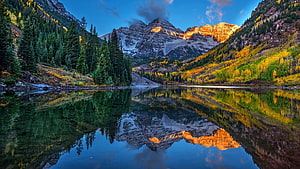 Alpine Lake Reflections with Golden Mountain Peaks and Autumn Forest HD wallpaper