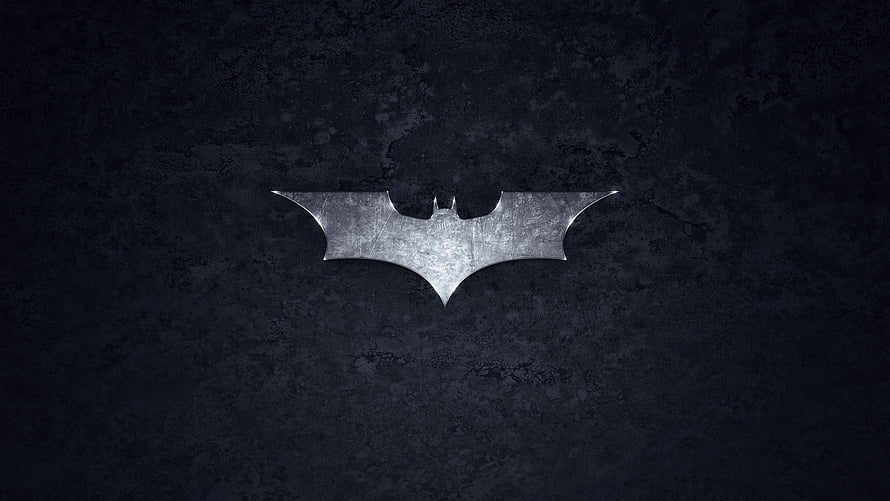 Metallic Batman Emblem on Dark Textured Concrete Surface HD wallpaper