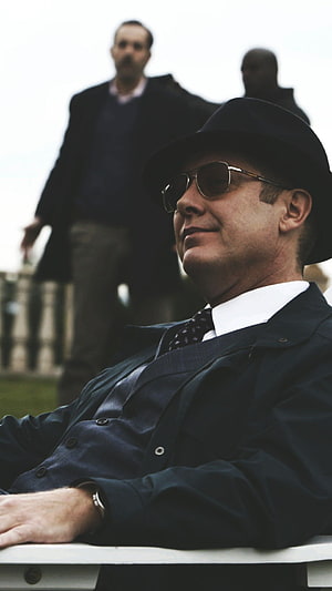 Raymond Reddington from The Blacklist in a dark coat and fedora with sunglasses HD phone wallpaper