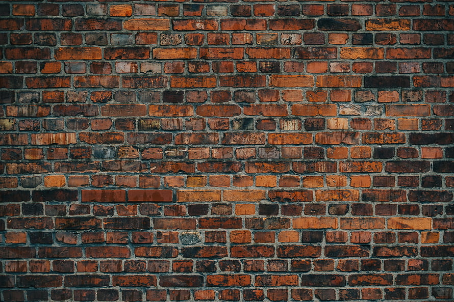 Weathered Red Brick Wall Texture with Dark Grout Lines and Rustic Industrial Character HD wallpaper
