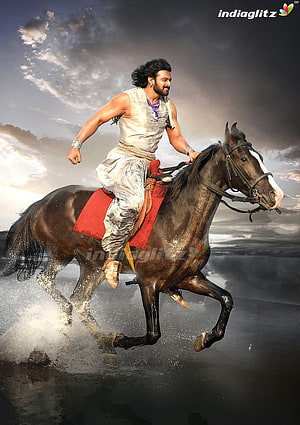 Prabhas as Baahubali riding a galloping horse through water in dramatic cinematic still HD phone wallpaper