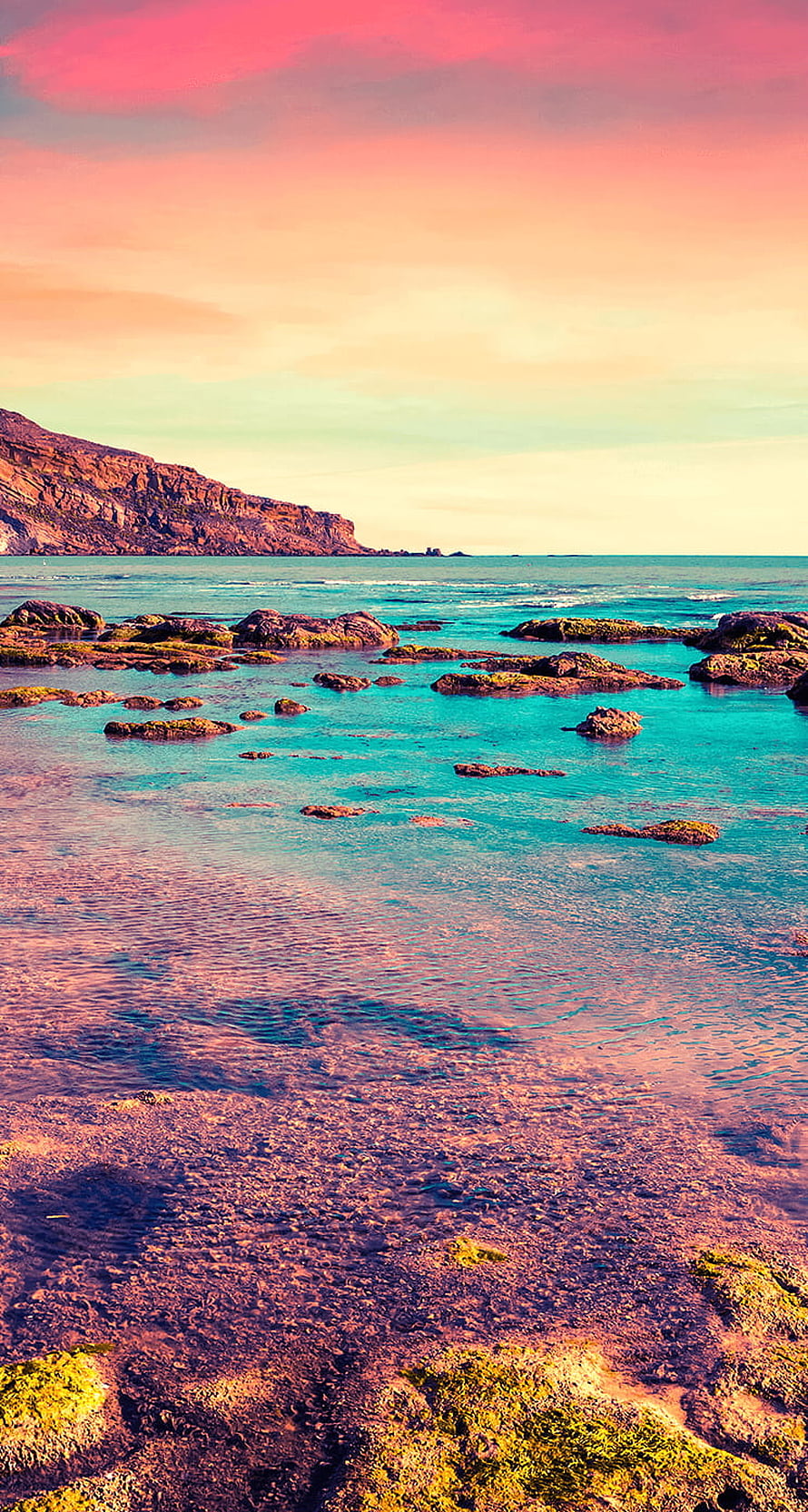 Vibrant Belize Coastline at Sunset with Turquoise Shallows and Rocky Shoreline HD phone wallpaper