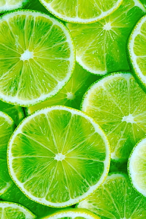Vibrant Green Lime Slices Patterned Background With Fresh Citrus Texture HD phone wallpaper