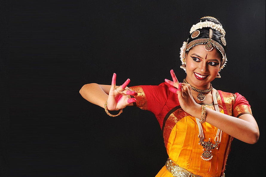 Bharatanatyam Dancer in Traditional Costume with Elaborate Jewelry and Hand Gestures HD wallpaper