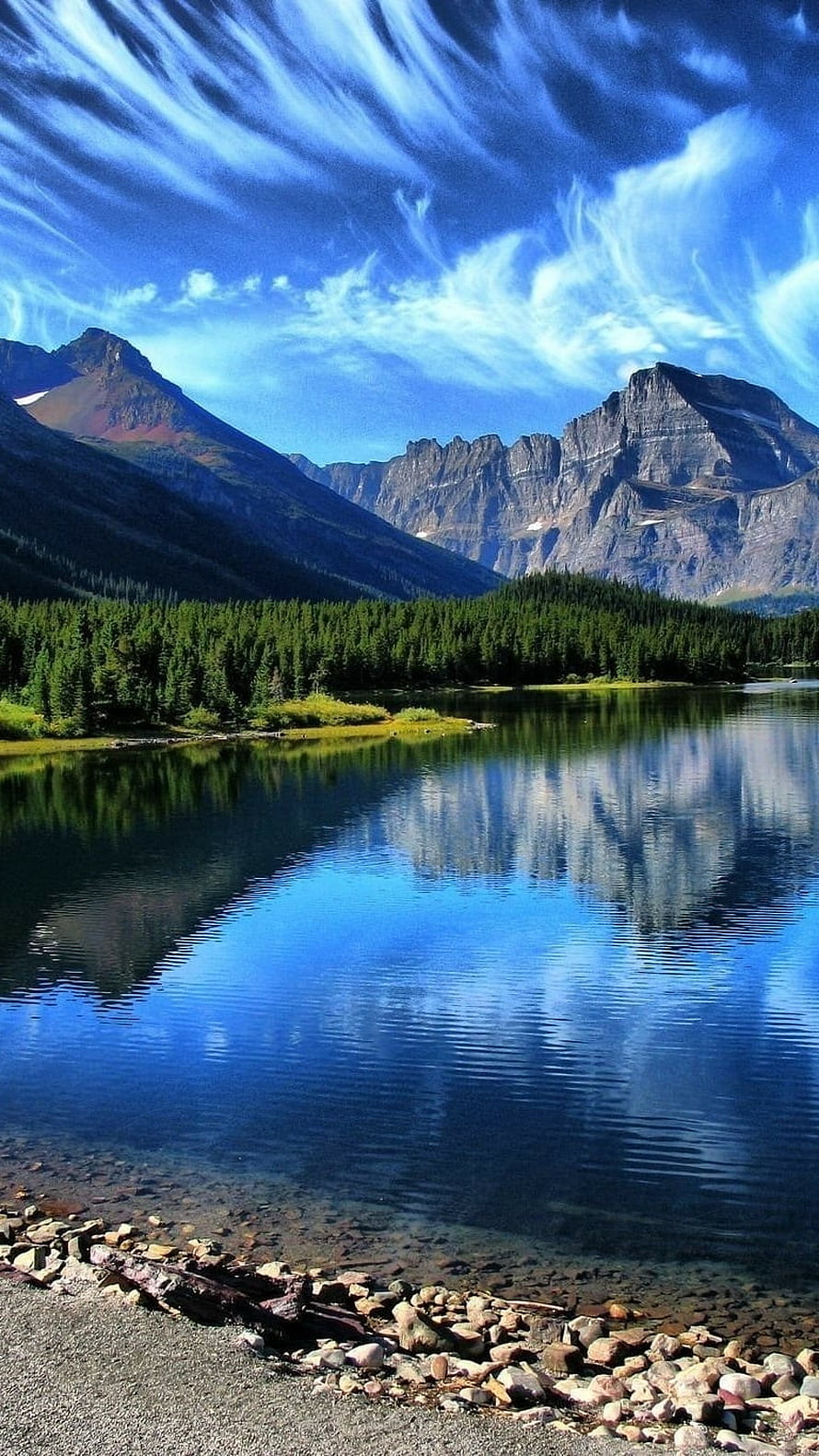Serene Mountain Lake with Perfect Reflections and Pine Forest Under a Blue Sky HD phone wallpaper