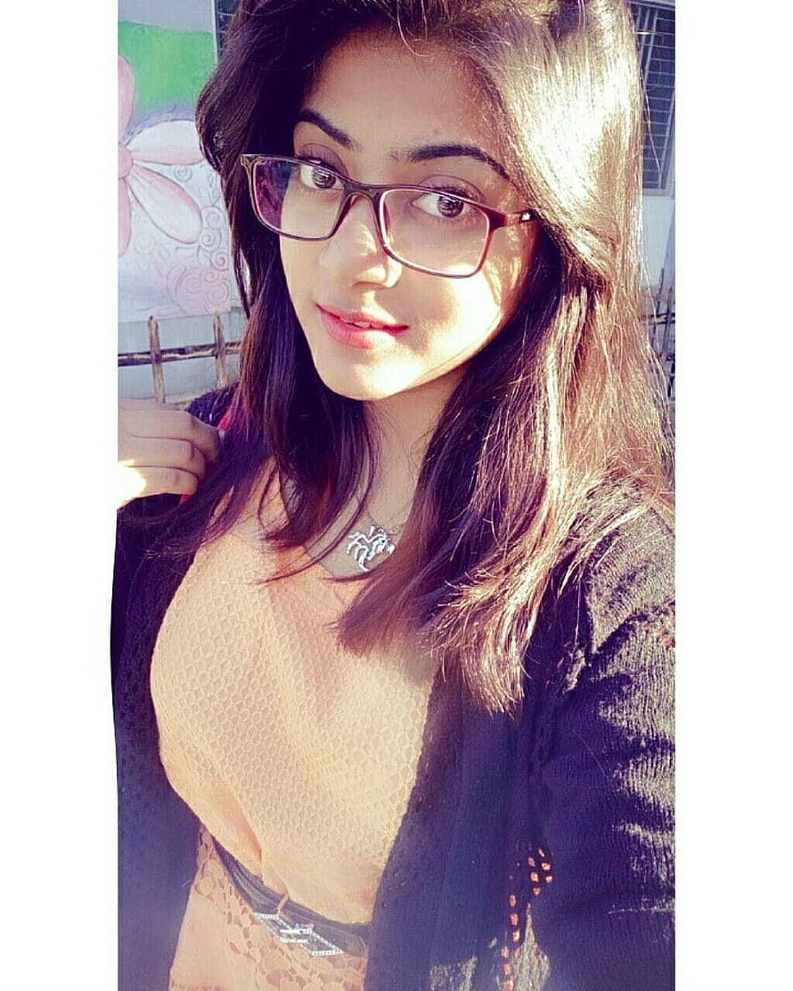 Young woman with long dark hair and rectangular glasses in a black cardigan HD phone wallpaper