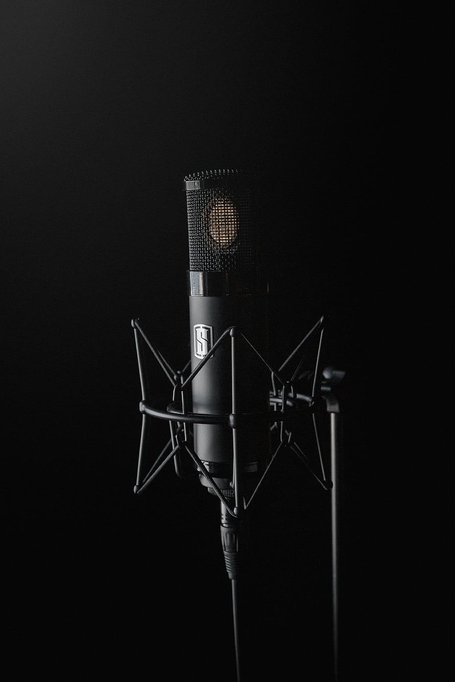 Professional Studio Condenser Microphone in Shock Mount Against Black Background HD phone wallpaper