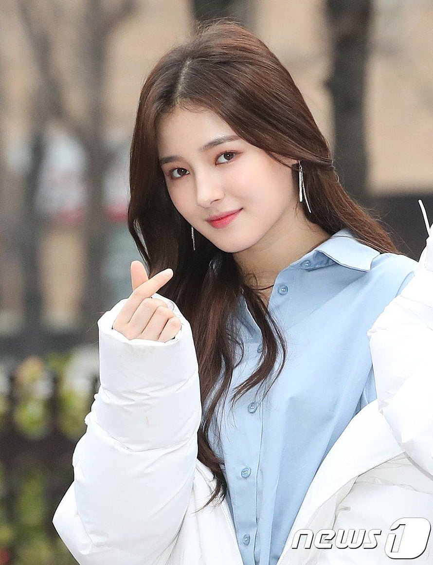 Nancy from MOMOLAND in a light blue shirt and white puffer jacket HD phone wallpaper