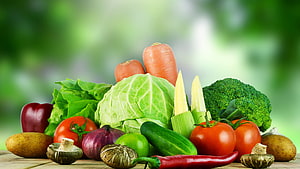 Fresh Organic Vegetable Arrangement With Carrots, Broccoli, Tomatoes, And Cabbage On Wooden Surface HD wallpaper