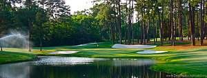Serene Golf Course Landscape With Water Hazard And Sprinklers HD wallpaper