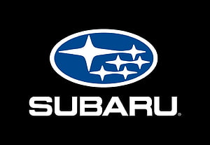 Subaru Brand Emblem Featuring Blue Oval and Star Cluster on Black Background HD wallpaper
