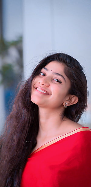 Sai Pallavi smiling portrait in a red sari with long dark hair and a bindi HD phone wallpaper