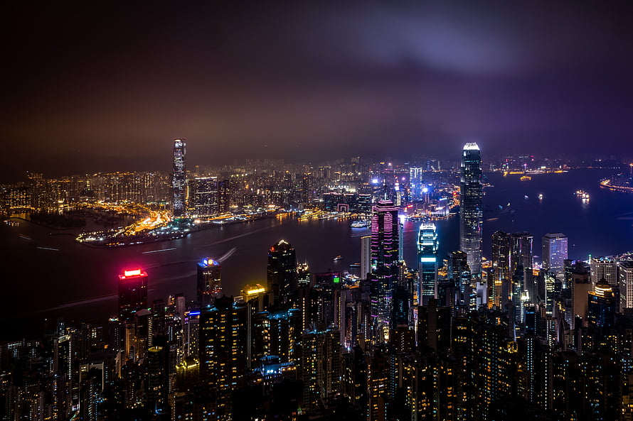 Aerial Night View of Hong Kong Skyline with Victoria Harbour and Illuminated Skyscrapers HD wallpaper