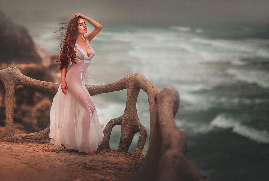 Ethereal Woman in Flowing White Dress Standing on Coastal Cliff with Ocean Waves, Ethereal Beauty, sea, digital, art, fantasy, graphy, girl, ethereal, woman HD wallpaper