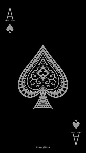 Minimalist Ace of Spades Playing Card Design with Ornate Central Emblem on Black Background HD phone wallpaper
