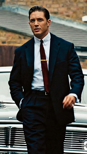 Tom Hardy in a Classic Dark Suit and Red Tie Standing Before a Vintage Car HD phone wallpaper