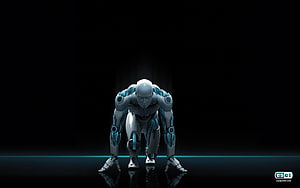 Crouching humanoid robot with glowing blue accents on a dark reflective surface HD wallpaper