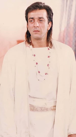 Sanjay Dutt in vintage white kurta with traditional jewelry and mullet hairstyle HD phone wallpaper