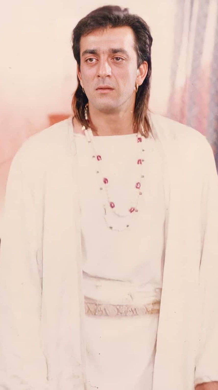Sanjay Dutt in vintage white kurta with traditional jewelry and mullet hairstyle HD phone wallpaper