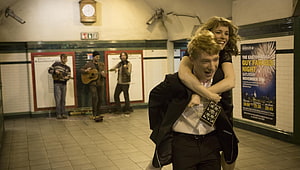 About Time Movie Scene: Couple in London Underground Station with Street Musicians HD wallpaper